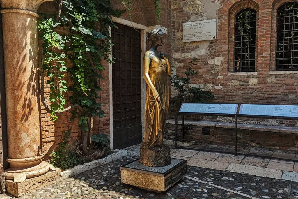 the famous Statue of Juliet beneath her balcony in Verona